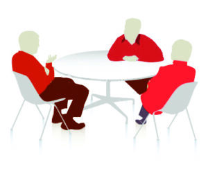 Three man sitting around table - Redline Company